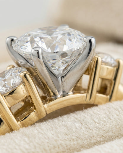 Round Brilliant, Classic Three Stone Round, in 18K Yellow Gold, prong setting – detail view | RockHer