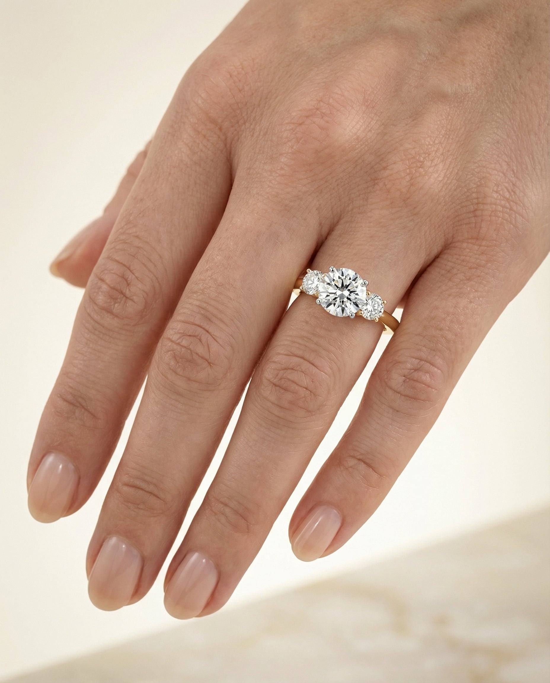 The Anita engagement ring setting in 18K Yellow Gold, classic three stone design | RockHer