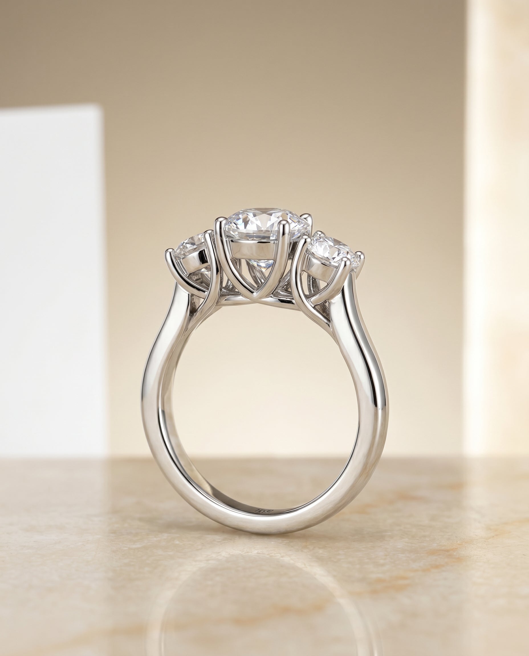 Classic Three Stone styling on The Natalie round engagement ring setting | RockHer