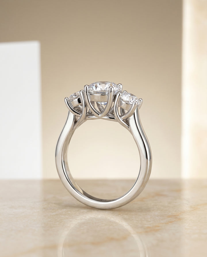 Round Brilliant, Classic Three Stone Round, in Platinum, pave setting – angled view | RockHer