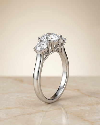Round Brilliant, Classic Three Stone Round, in Platinum, pave setting – front view | RockHer