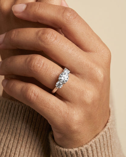 Natalie Select Classic Three Stone Round Lab Diamond Engagement Ring in 18K White Gold, shown on hand, angled | RockHer
