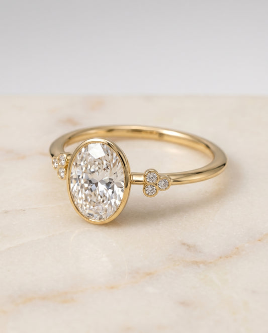 The Selena Bezel Solitaire Engagement Ring Setting for Oval Diamonds in 18K Yellow Gold | RockHer
