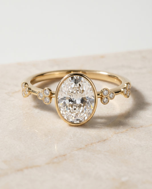 The Miley Bezel Solitaire Engagement Ring Setting for Oval Diamonds in 18K Yellow Gold | RockHer