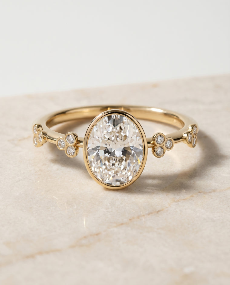 The Miley Clover Bezel Accent Solitaire Oval Engagement Ring Setting in 18K Yellow Gold