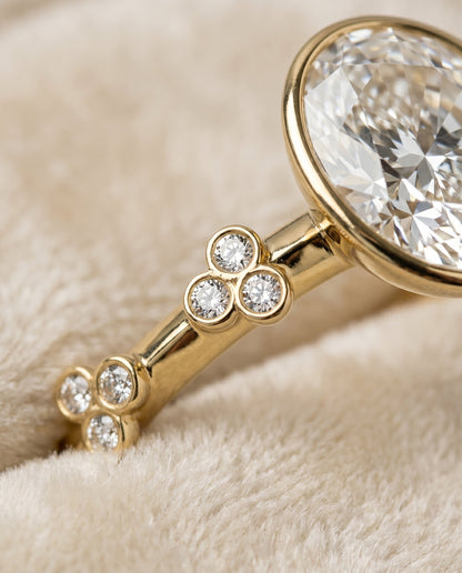Miley Select Clover Bezel Accent Solitaire Oval Lab Diamond Engagement Ring in 18K Yellow Gold, detail view | RockHer