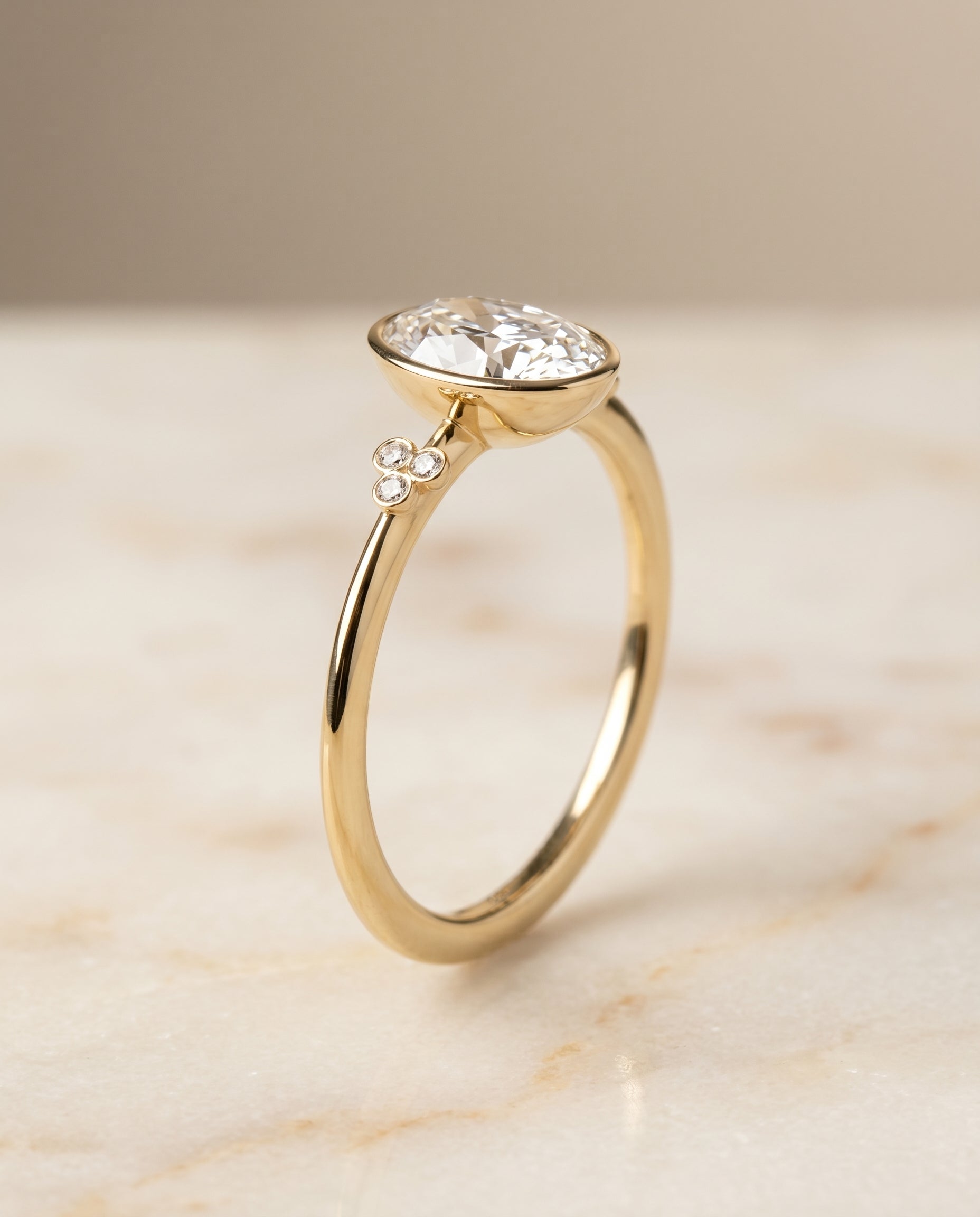 Clover Bezel Accent Solitaire styling on The Selena oval engagement ring setting | RockHer