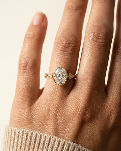 The Miley Clover Bezel Accent Solitaire Oval Engagement Ring Setting in 18K Yellow Gold