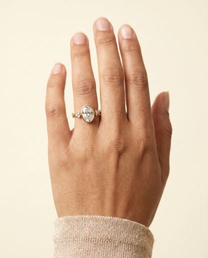 The Miley Clover Bezel Accent Solitaire Oval Engagement Ring Setting in 18K Yellow Gold