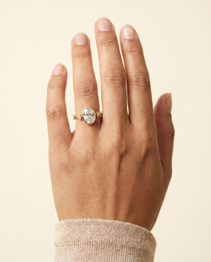 The Miley Clover Bezel Accent Solitaire Oval Engagement Ring Setting in 18K Yellow Gold