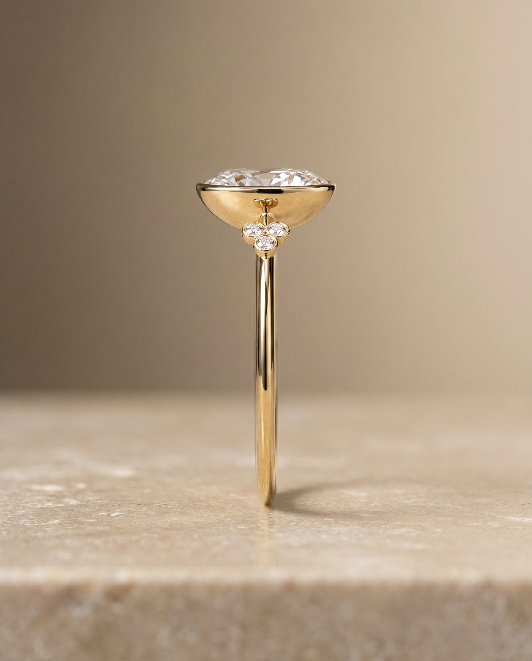 The Selena clover bezel accent solitaire engagement ring setting, shown in 18K Yellow Gold | RockHer