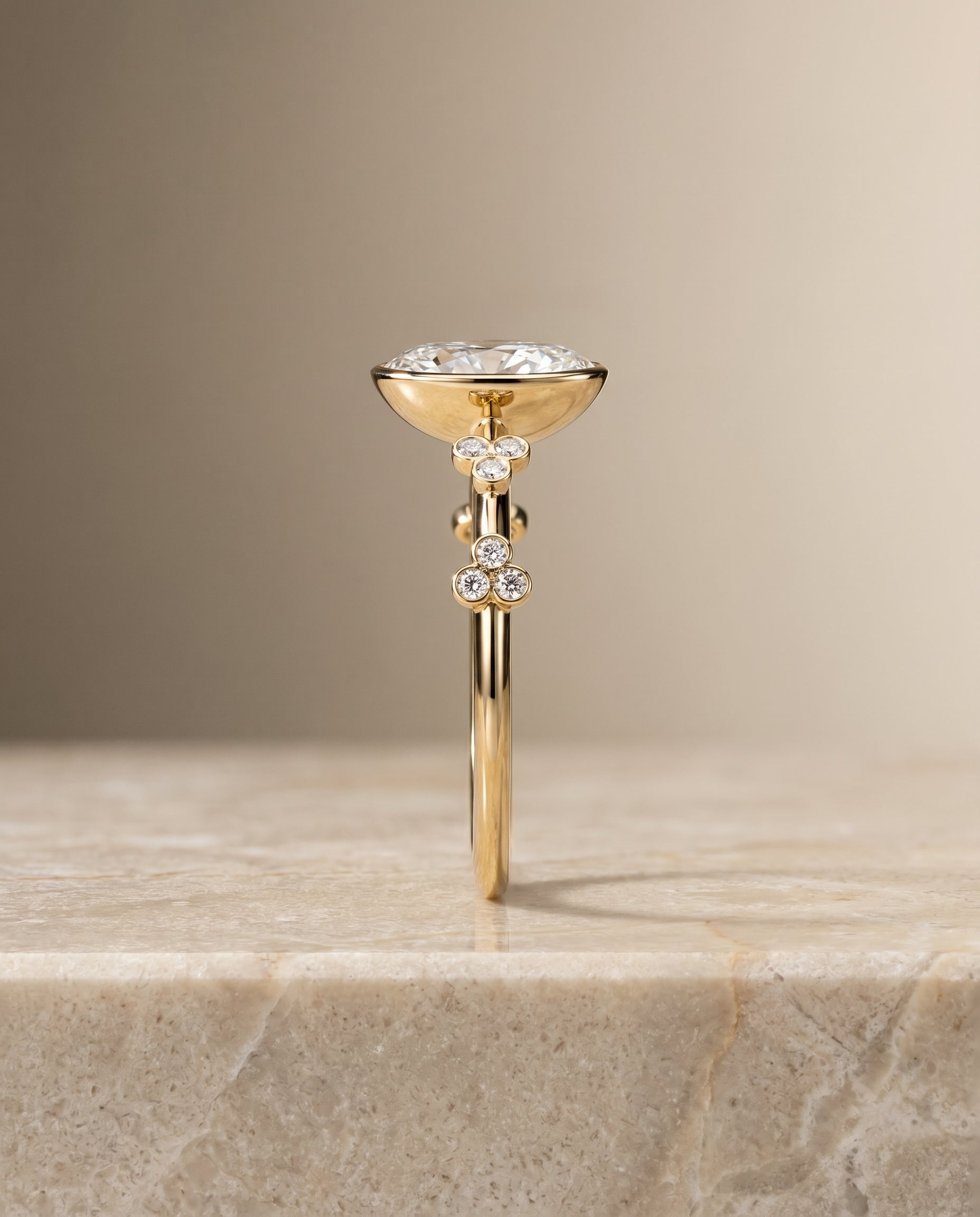 The Miley clover bezel accent solitaire engagement ring setting, shown in 18K Yellow Gold | RockHer