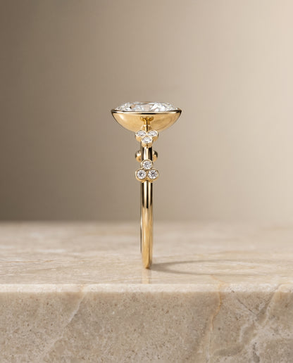 The Miley Clover Bezel Accent Solitaire Oval Engagement Ring Setting in 18K Yellow Gold