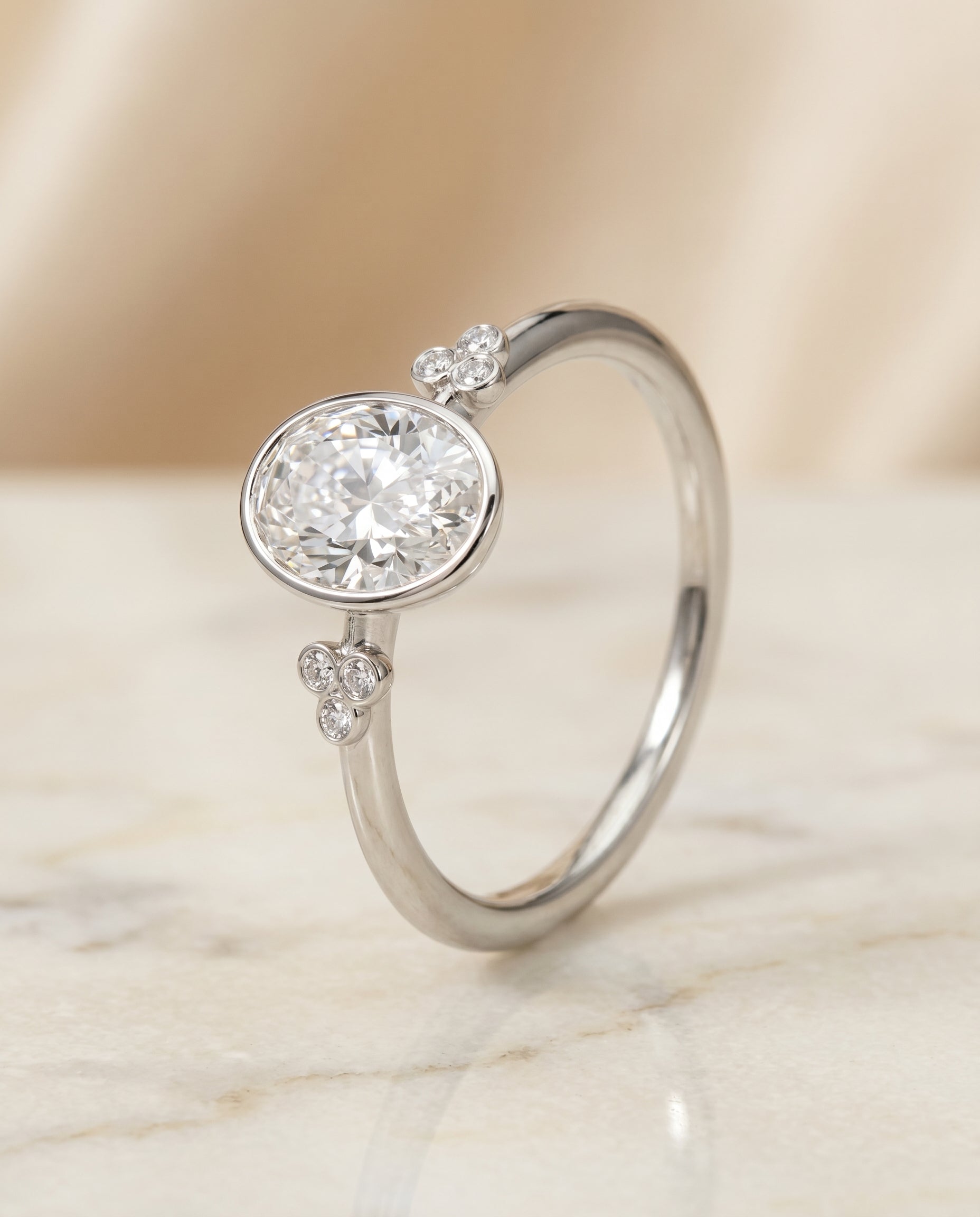 Selena Select Clover Bezel Accent Solitaire Oval Lab Diamond Engagement Ring in Platinum, front view | RockHer