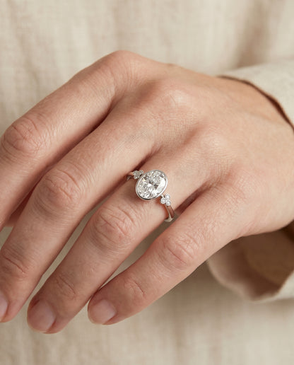 The Selena Clover Bezel Accent Solitaire Oval Engagement Ring Setting in Platinum