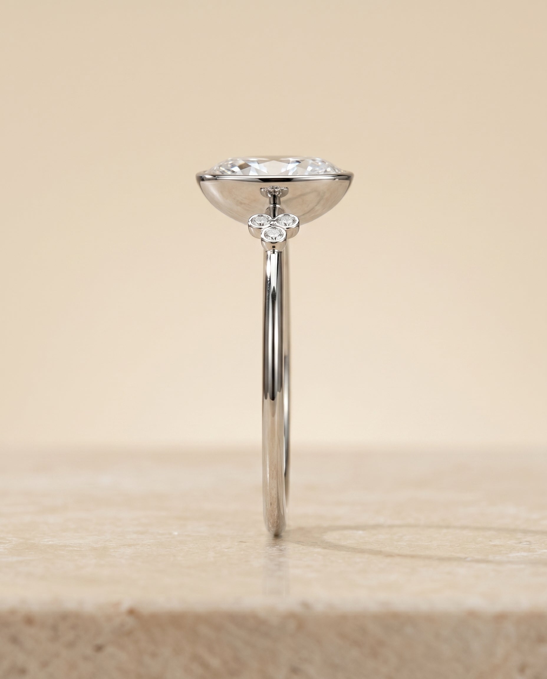 The Selena clover bezel accent solitaire engagement ring setting, shown in 18K White Gold | RockHer