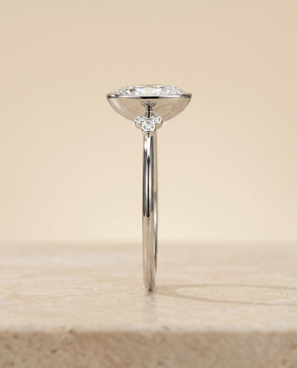 The Selena Clover Bezel Accent Solitaire Oval Engagement Ring Setting in Platinum