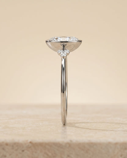 Selena Select Clover Bezel Accent Solitaire Oval Lab Diamond Engagement Ring in Platinum, side view | RockHer