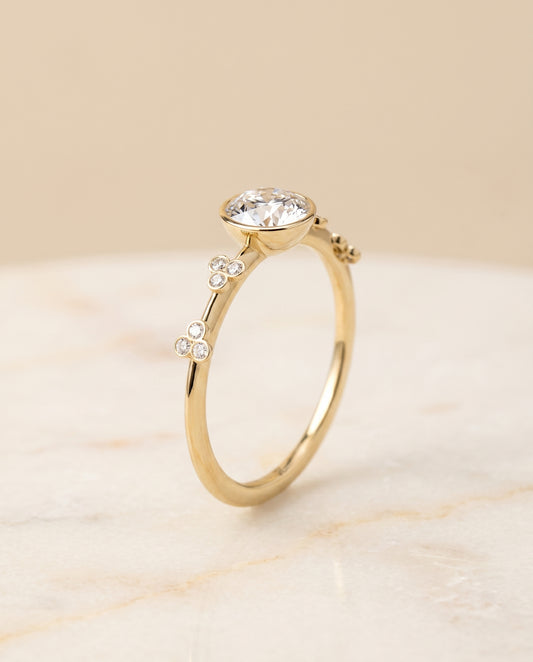The Miley Bezel Solitaire Engagement Ring Setting for Round Diamonds in 18K Yellow Gold | RockHer