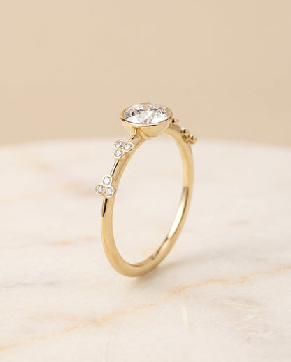 Miley Select Clover Bezel Accent Solitaire Round Lab Diamond Engagement Ring in 18K Yellow Gold, front view | RockHer