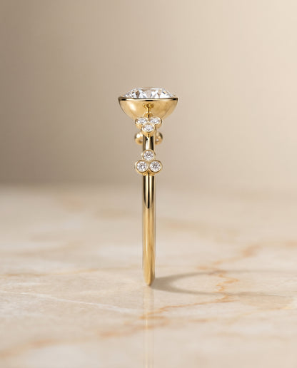 The Miley Clover Bezel Accent Solitaire Round Engagement Ring Setting in 18K Yellow Gold