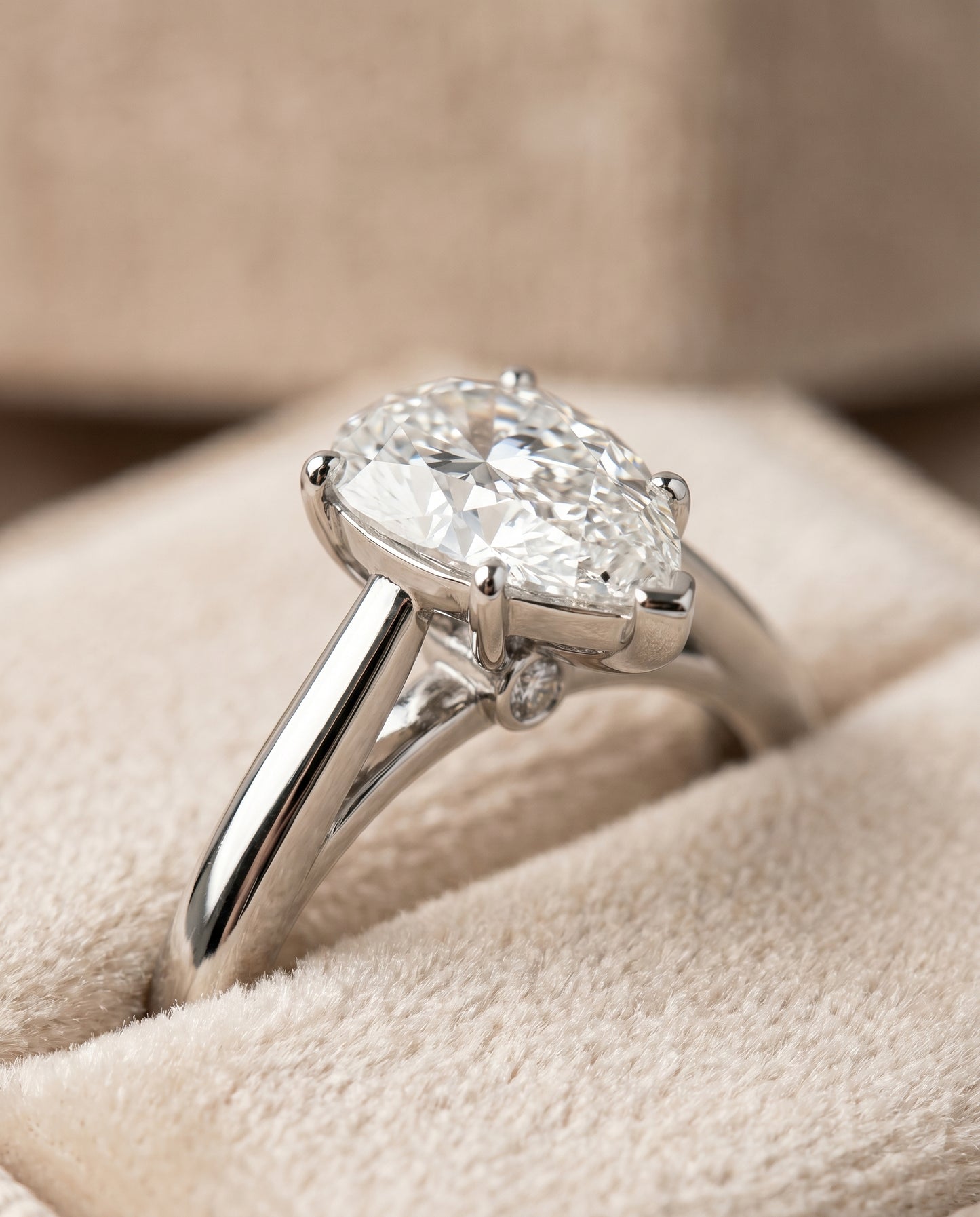 Comfort Fit Secret Stone Solitaire Pear Shape, in Platinum – detail view | RockHer