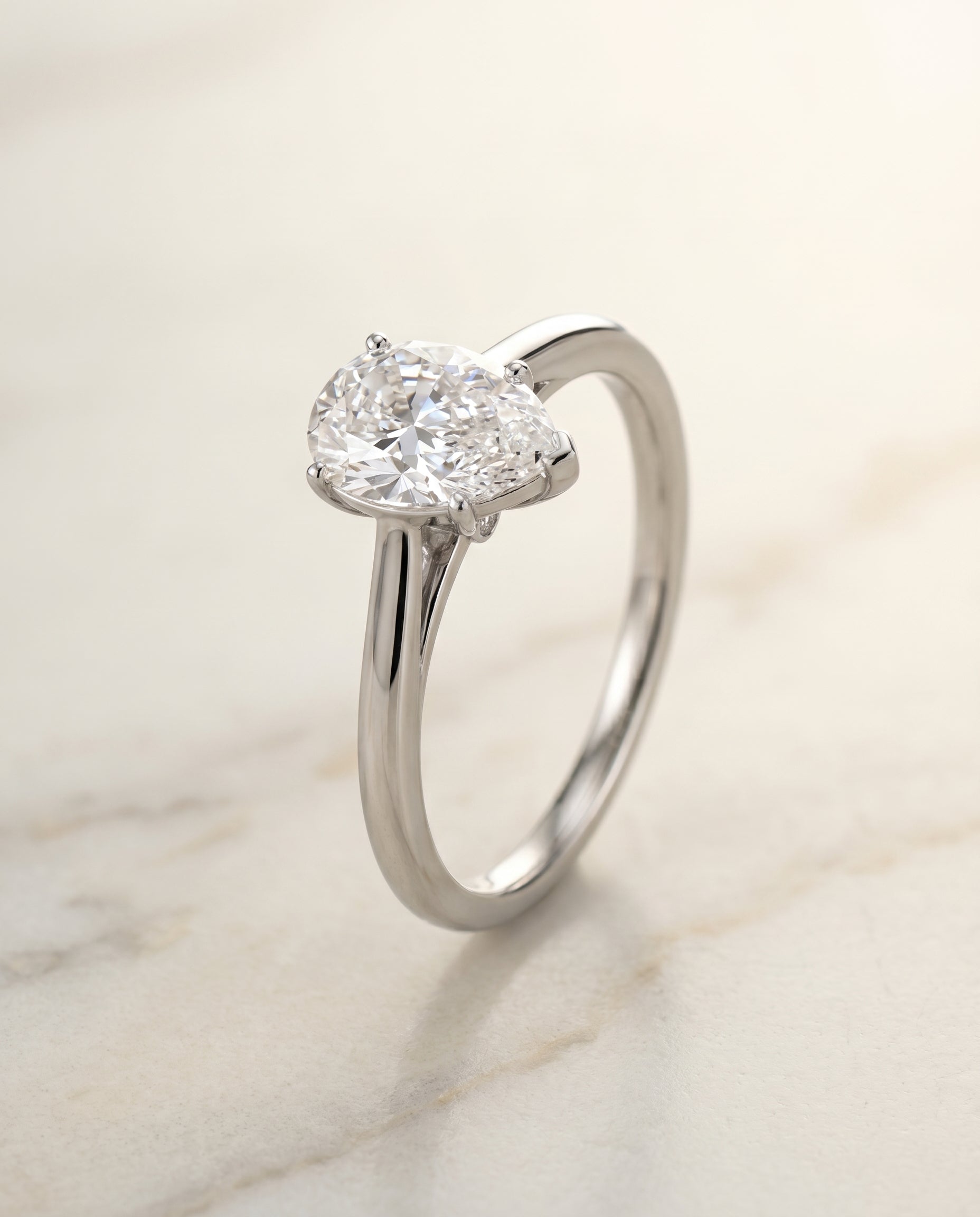Comfort Fit Secret Diamond Solitaire styling on The Valerie pear engagement ring setting | RockHer