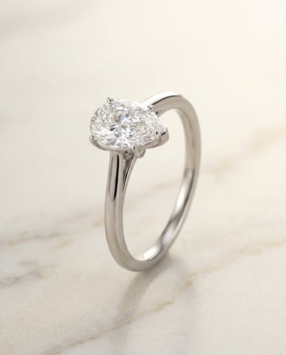 Comfort Fit Secret Stone Solitaire Pear Shape, in Platinum – front view | RockHer
