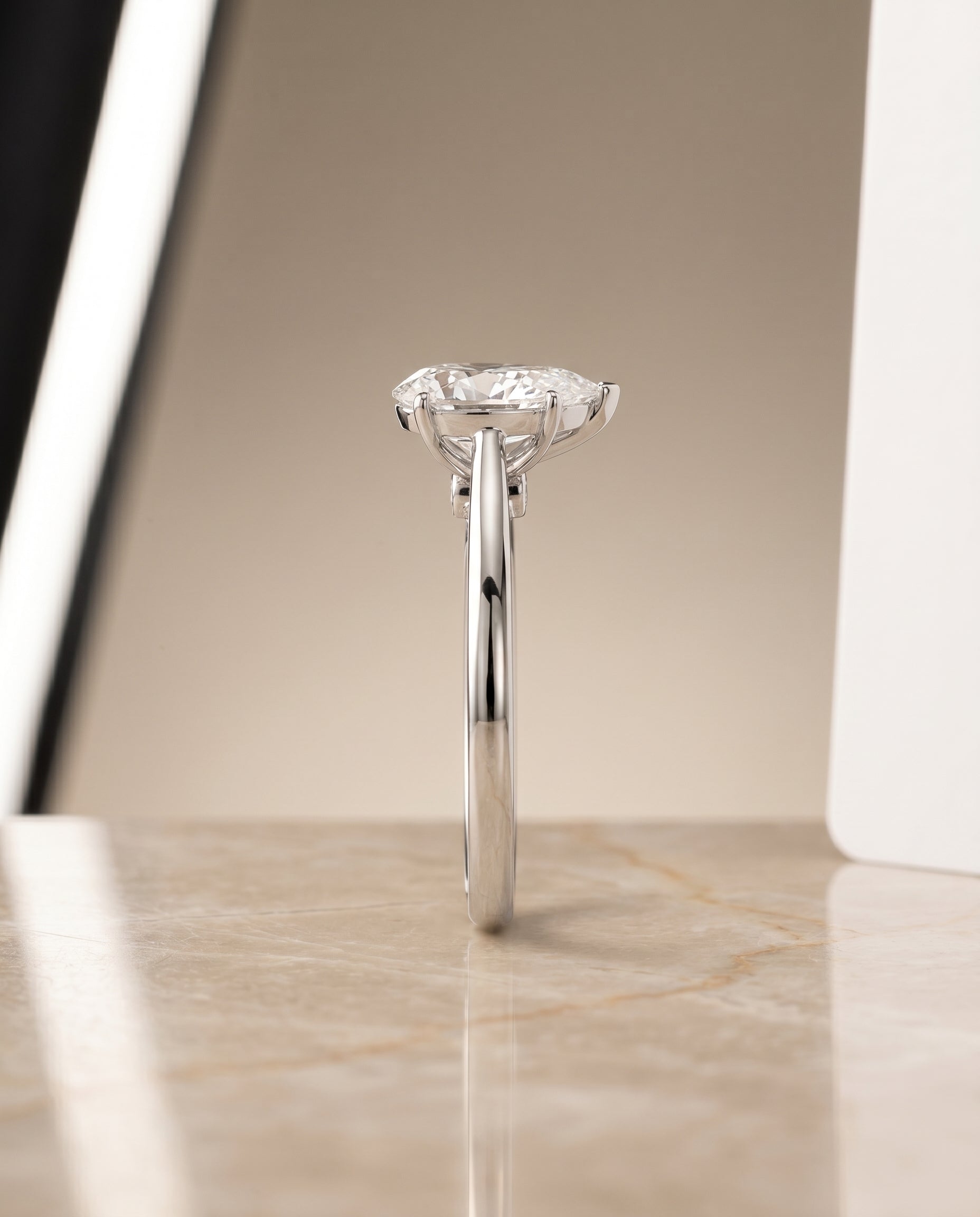 The Valerie comfort fit secret diamond solitaire engagement ring setting, shown in Platinum | RockHer