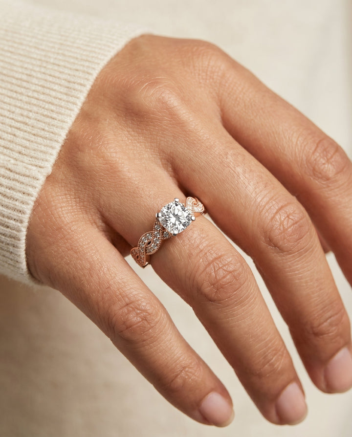 Marie Select Beaded Crossover Pavé Cushion Cut Lab Diamond Engagement Ring in 14K Rose Gold, shown on hand, angled | RockHer
