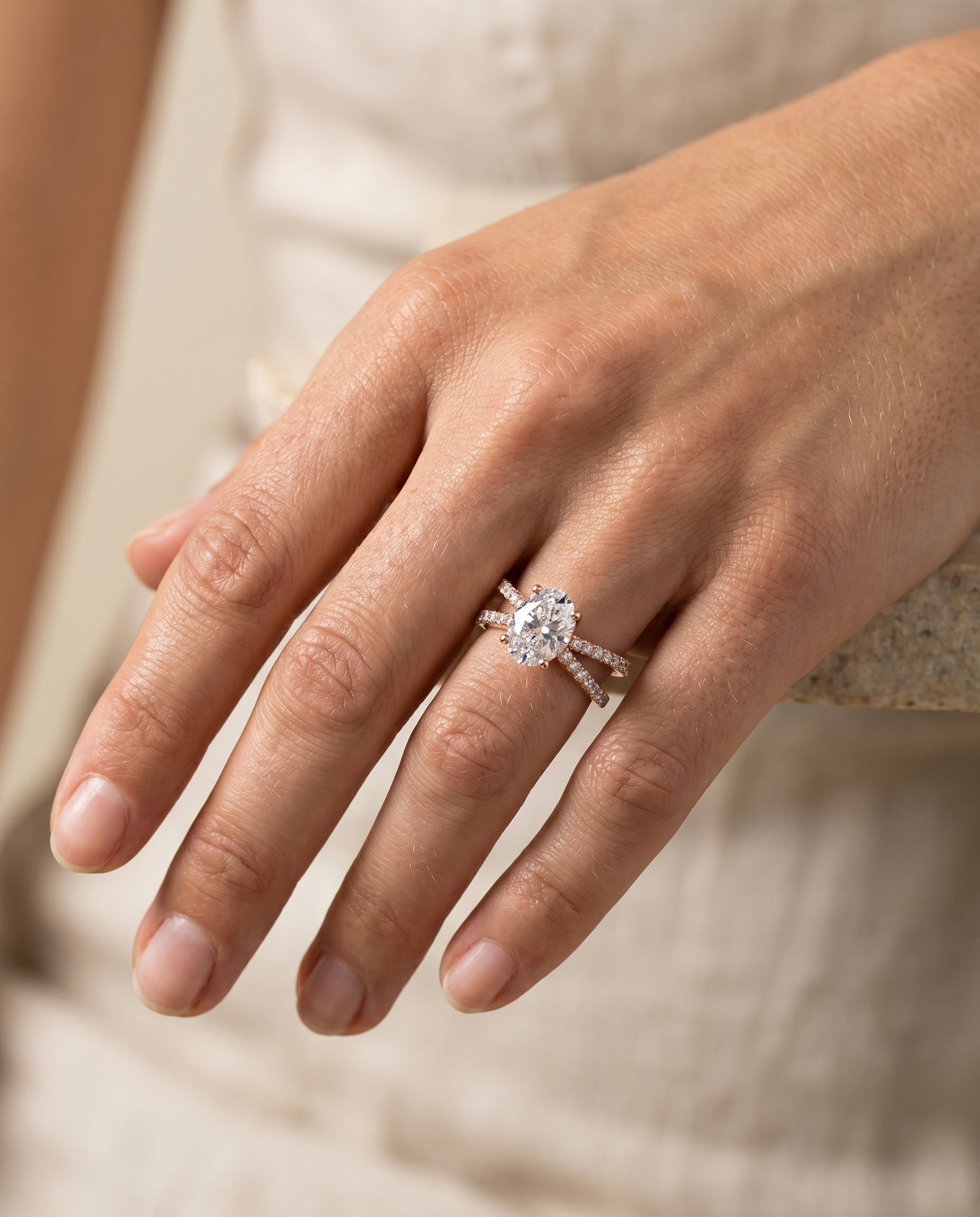 Sadie Select Twisted Pavé Oval Lab Diamond Engagement Ring in 14K Rose Gold, shown on hand, angled | RockHer