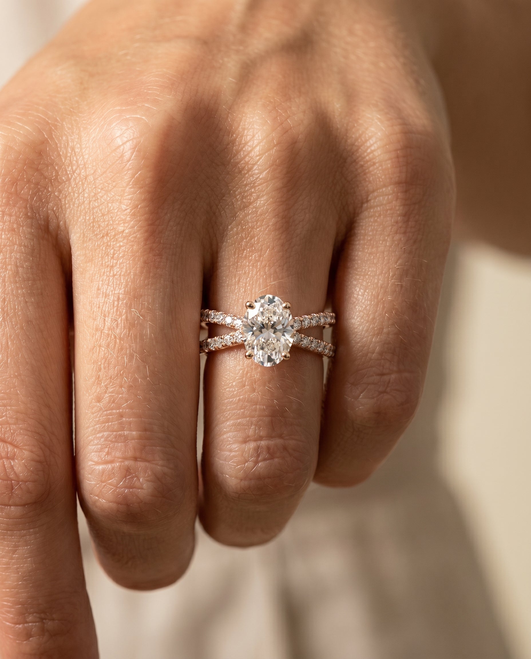 Sadie Select Twisted Pavé Oval Lab Diamond Engagement Ring in 14K Rose Gold, shown on hand | RockHer