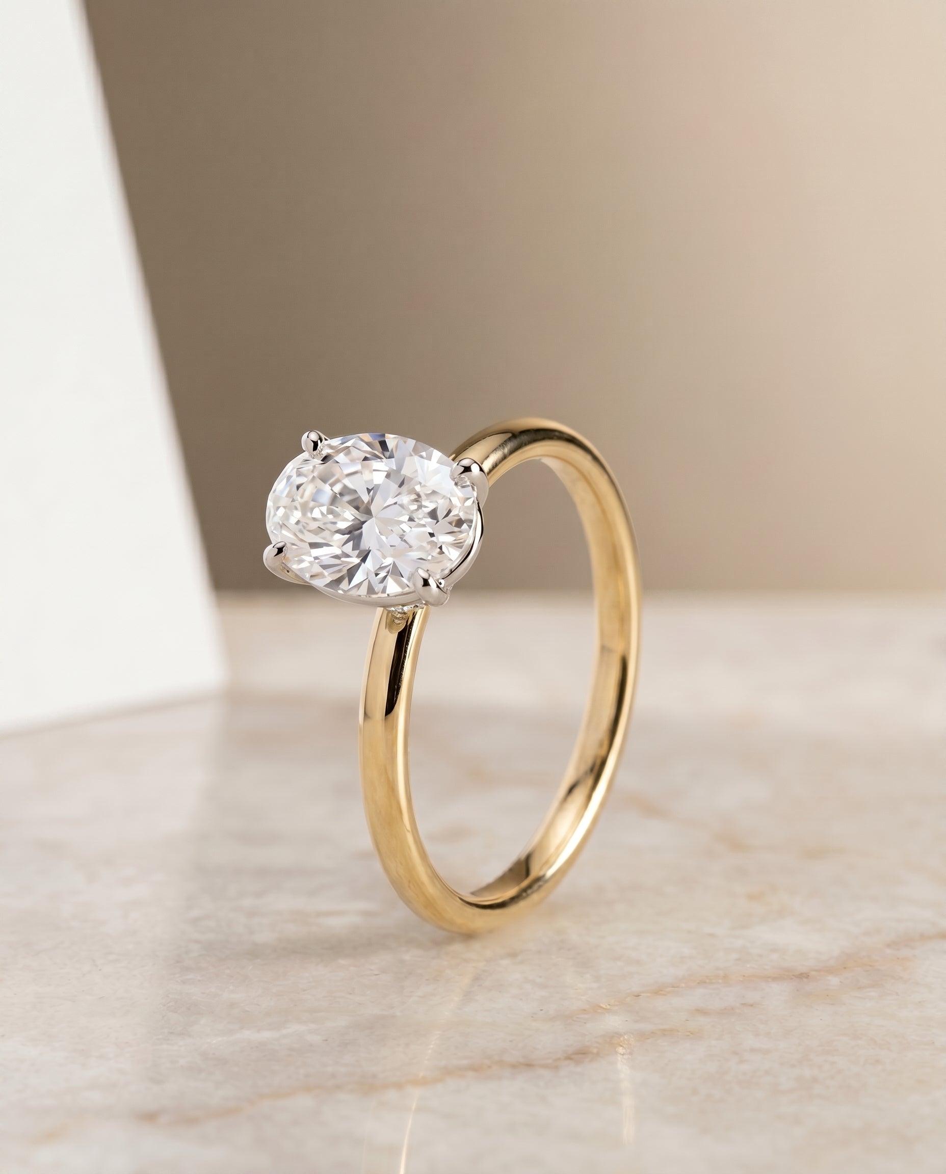 The Cyndi curved hidden halo solitaire engagement ring setting, shown in 18K Yellow Gold | RockHer