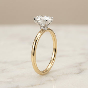 The Cyndi Curved Hidden Halo Solitaire Oval Engagement Ring Setting in 18K Yellow Gold