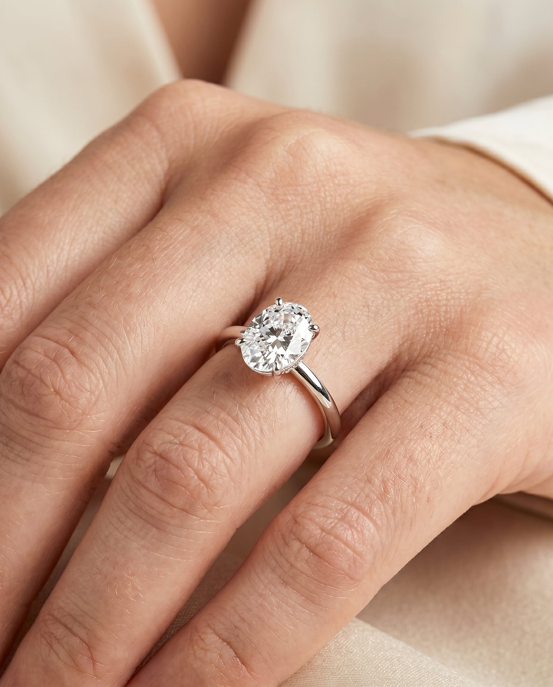 The Cyndi engagement ring setting in 18K White Gold, curved hidden halo solitaire design | RockHer