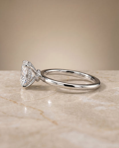The Cyndi Curved Hidden Halo Solitaire Oval Engagement Ring Setting in Platinum