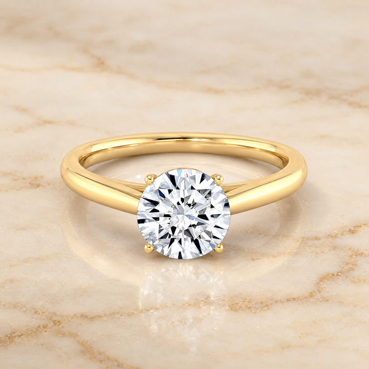 The Valerie Comfort Fit Secret Stone Solitaire Round Engagement Ring Setting in 18K Yellow Gold