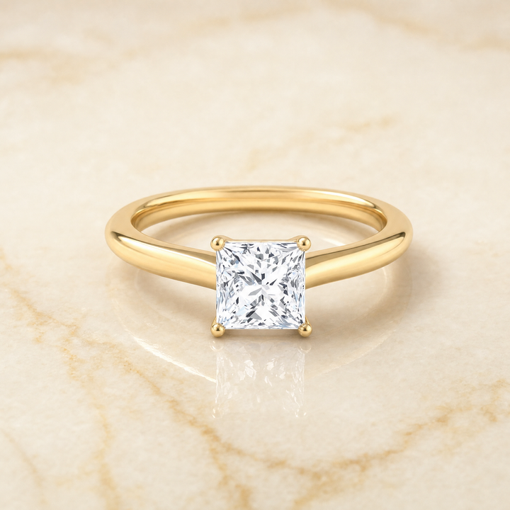 The Gladys Pinched Cathedral Solitaire Princess Cut Engagement Ring Setting in 18K Yellow Gold