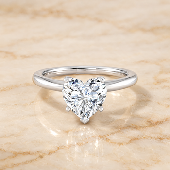 The Floria Comfort Fit Claw Prong Solitaire Heart Engagement Ring Setting in 18K White Gold