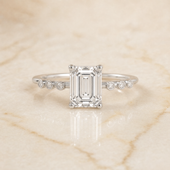 The Peggy Bezel Accent Solitaire Emerald Cut Engagement Ring Setting in Platinum