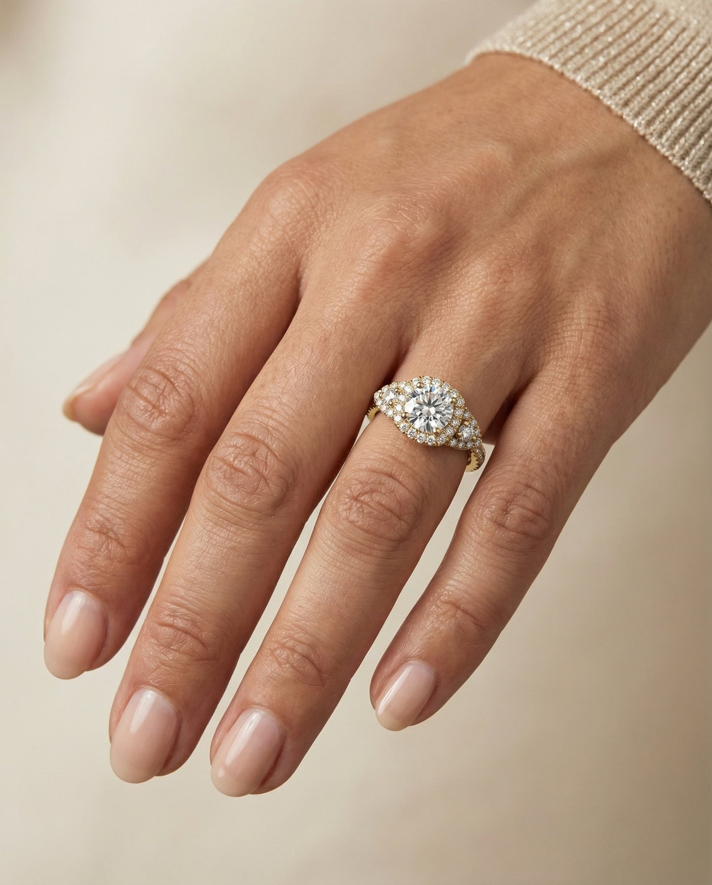 Round Brilliant, Delicate Three Stone Halo, in 18K Yellow Gold, pave setting – lifestyle shot | RockHer