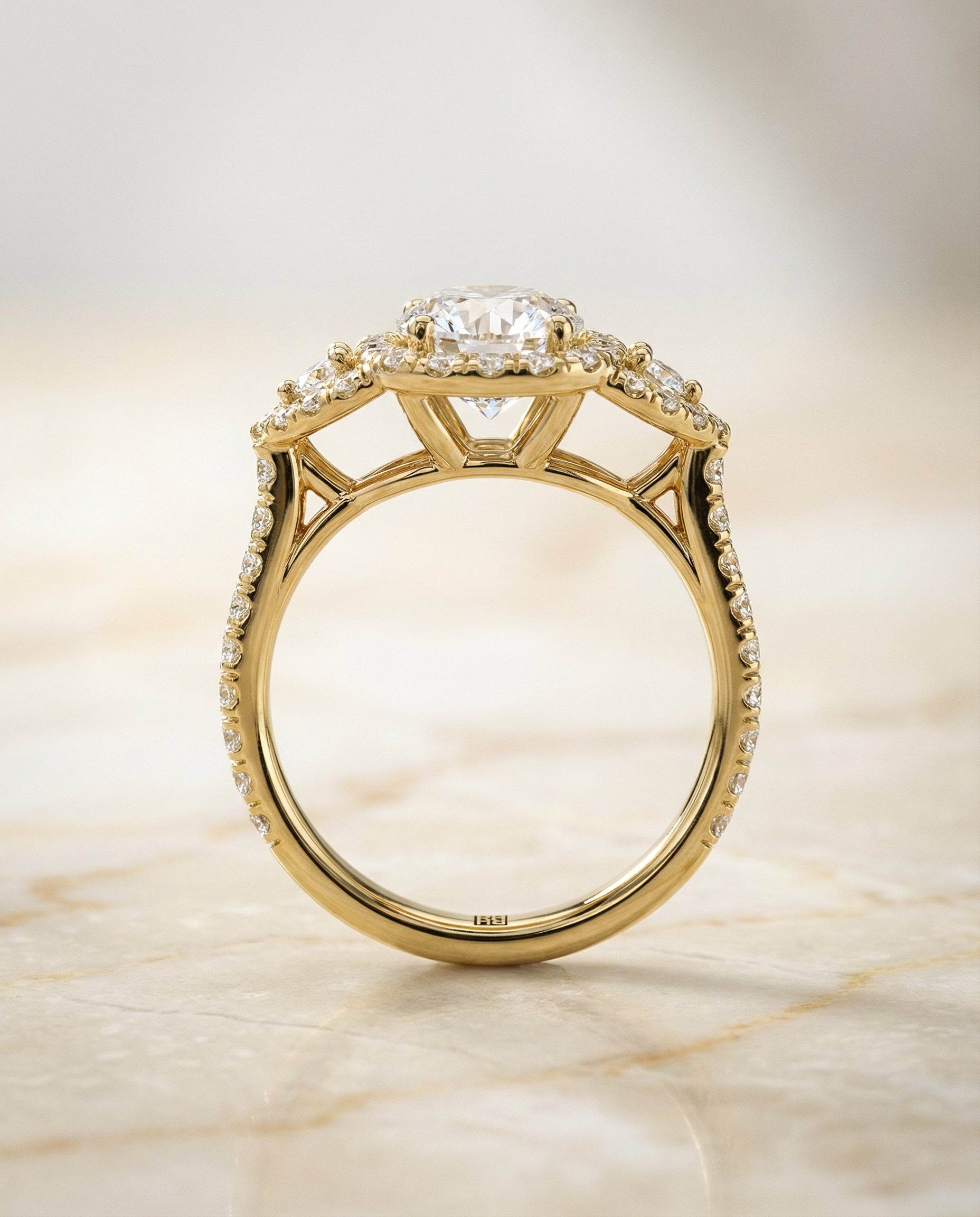 Delicate Three Stone Halo styling on The Jennifer round engagement ring setting | RockHer
