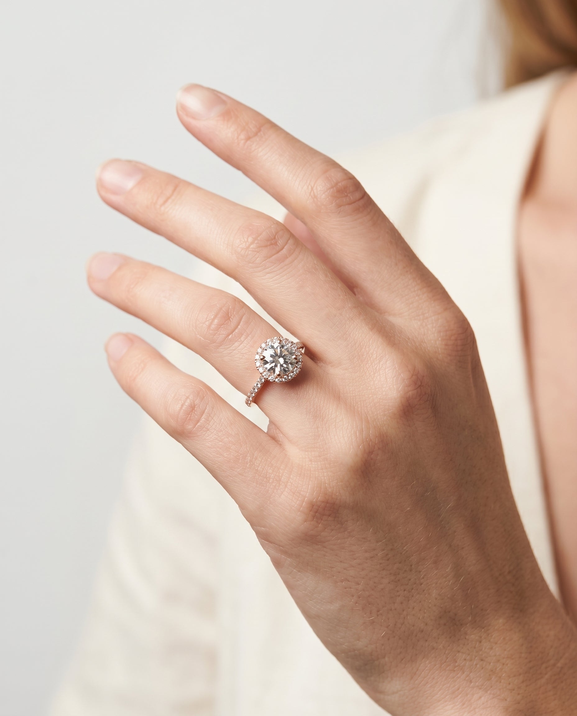 The Dionne engagement ring setting in 14K Rose Gold, diamond pavé halo design | RockHer