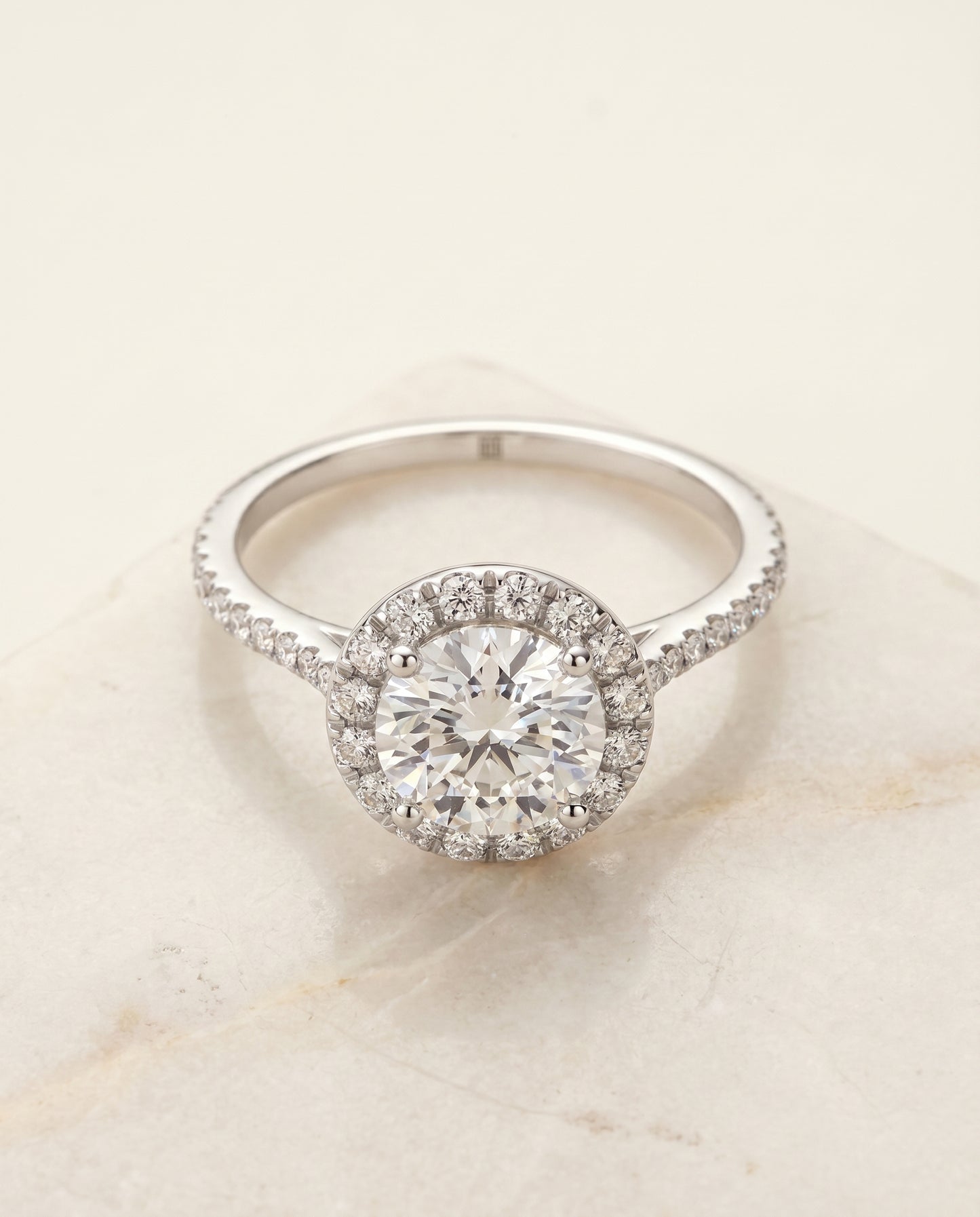 Round Brilliant, Diamond Pavé Halo, in Platinum, pave setting – angled view | RockHer