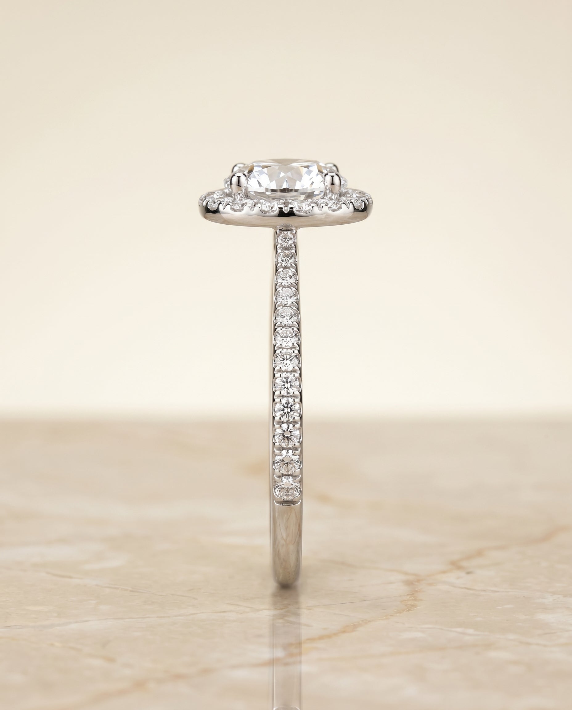 The Dionne diamond pavé halo engagement ring setting, shown in Platinum | RockHer