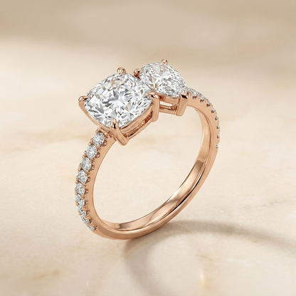 14K Rose Gold Diana Select Toi et Moi Cushion & Pear Pavé Band Lab Diamond Engagement Ring - Alt angle on warm marble