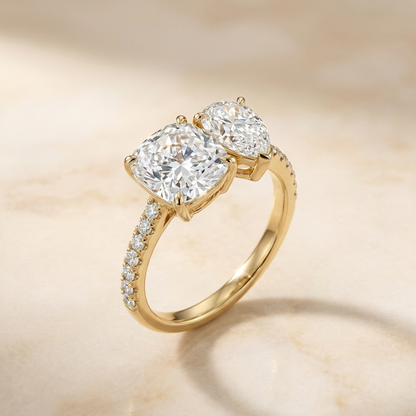 14K Yellow Gold Diana Select Toi et Moi Cushion & Pear Pavé Band Lab Diamond Engagement Ring - Alt angle on warm marble