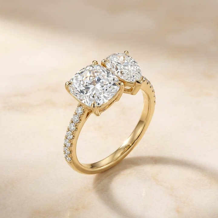 14K Yellow Gold Diana Select Toi et Moi Cushion & Pear Pavé Band Lab Diamond Engagement Ring - Alt angle on warm marble