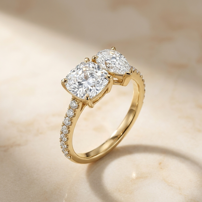 18K Yellow Gold Diana Select Toi et Moi Cushion & Pear Pavé Band Lab Diamond Engagement Ring - Alt angle on warm marble