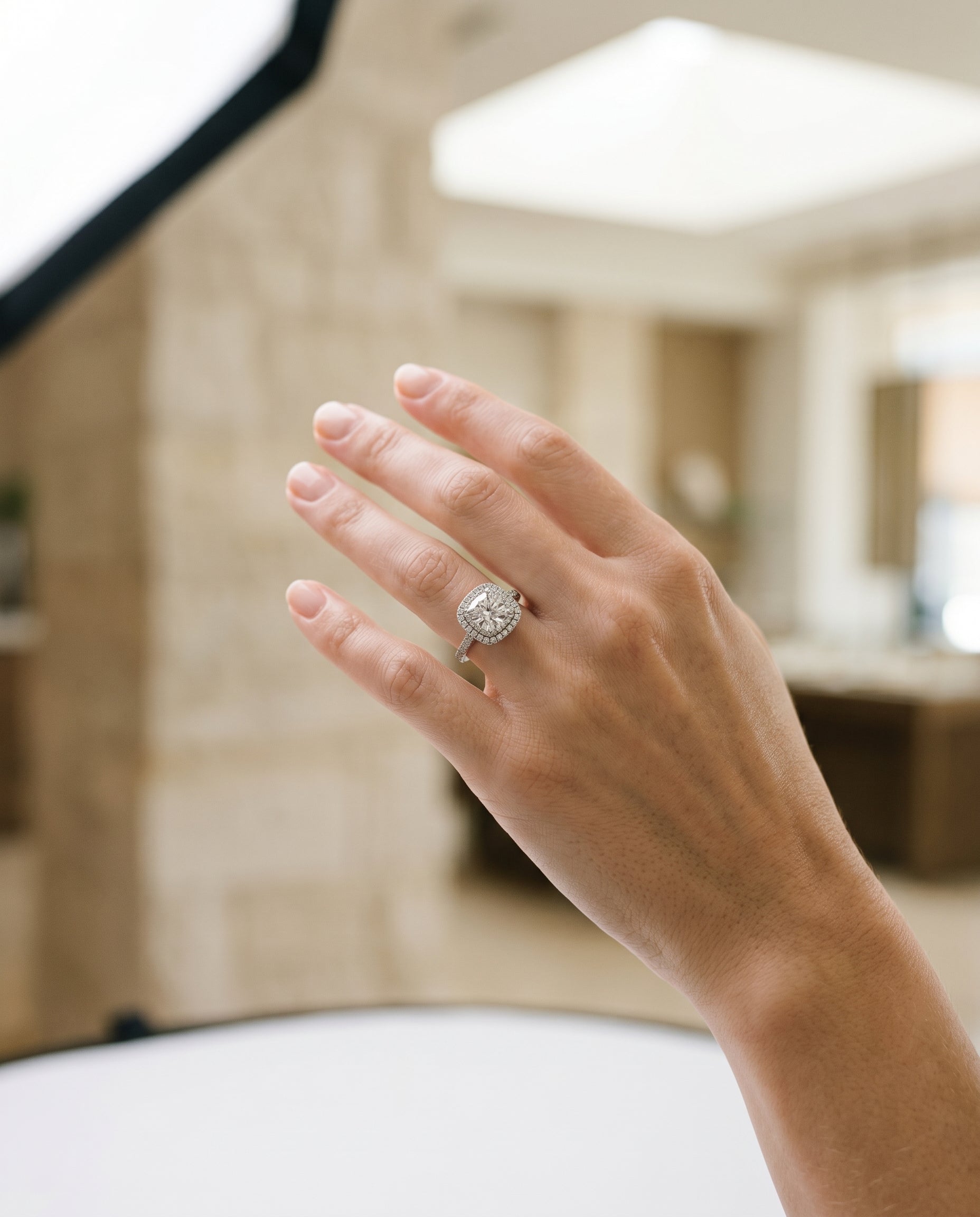 Cadence Select Double Halo Cushion Cut Lab Diamond Engagement Ring in 18K White Gold, shown on hand, angled | RockHer